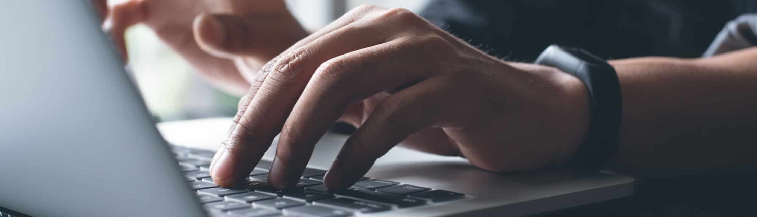 Man on computer researching electric liens